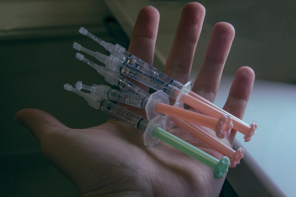 Close-up, cinematic shot of a human hand gently making contact with a futuristic robotic hand, symbolizing the connection ...