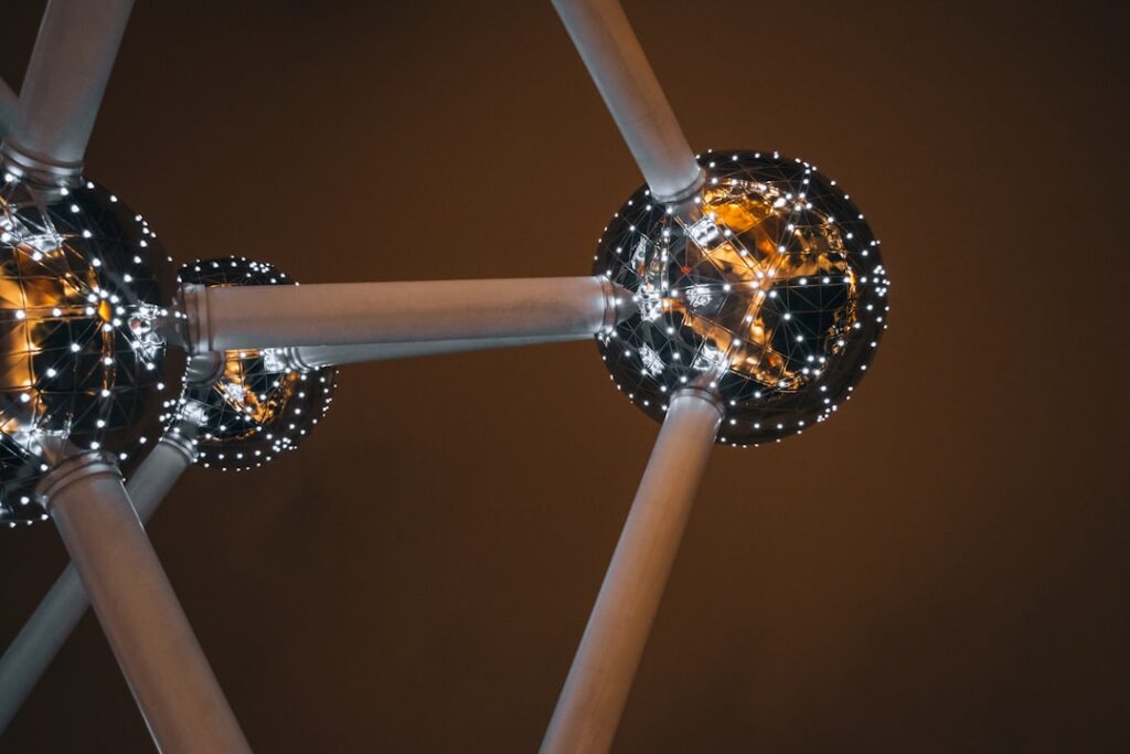 Abstract visualization of interconnected glowing nodes and lines on a dark background, representing a digital network or A...