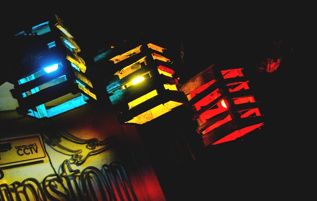 A close-up, brightly lit image of intricate, glowing pathways on a circuit board, representing the evolution from simple, linear scripts to complex, multi-path autonomous systems.