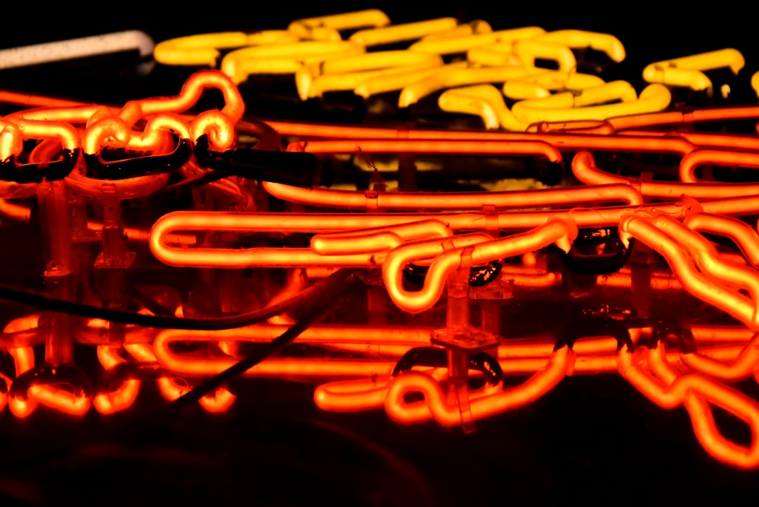 An intricate and modern circuit board with glowing pathways of light, illustrating the complex connections required to orchestrate disparate AI systems into a unified engine.