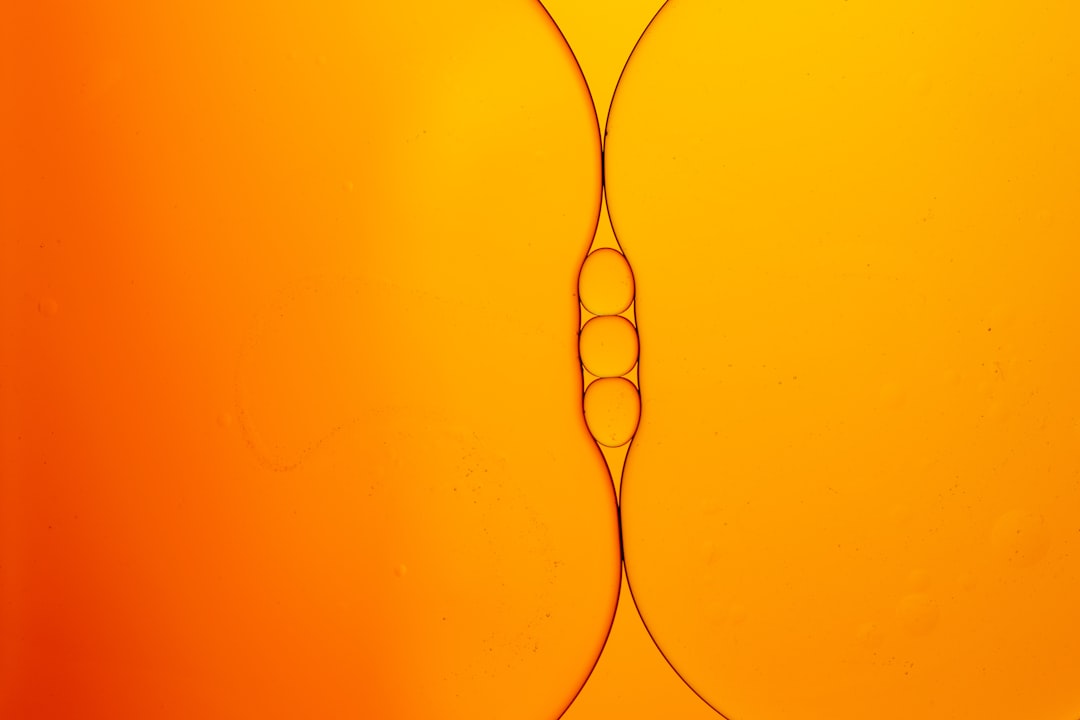 A macro, close-up photo of a computer circuit board with trails of light moving along its pathways, illustrating machine-to-machine communication.