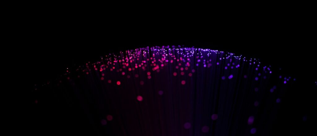 Modern, abstract visualization of a knowledge graph with glowing blue nodes and interconnected lines on a dark, profession...