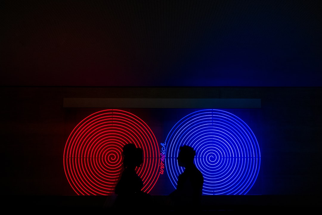 A person in a sleek, modern office interacting with a floating, holographic interface displaying complex data, symbolizing the integration of custom AI agents into the workforce.