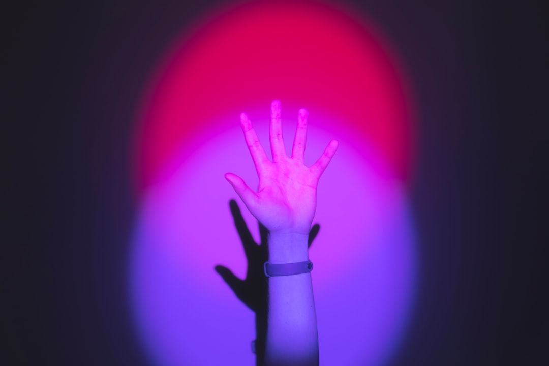 A person's hands manipulating a glowing, futuristic holographic interface, illustrating the new era of AI that acts on complex commands.