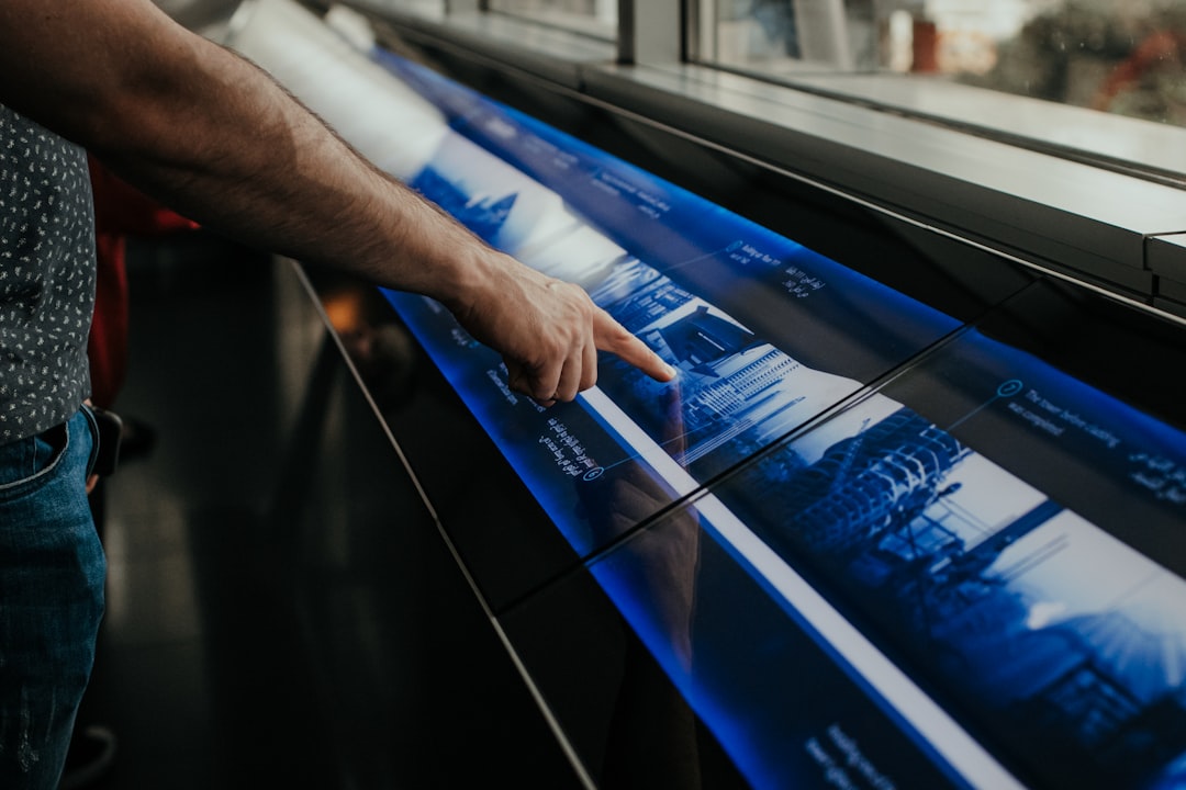 A professional in a dark, modern office interacting with a floating holographic interface displaying a complex data network, symbolizing the new model of predictive growth.