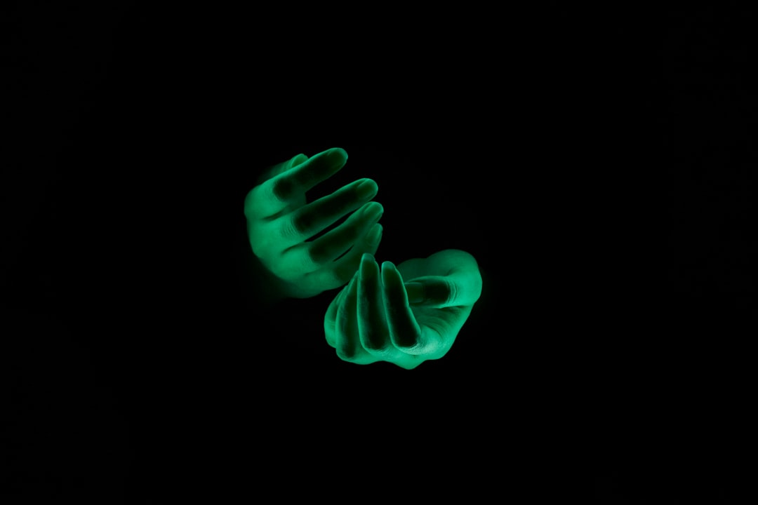 A professional's hand interacting with a floating, glowing holographic data interface, symbolizing a custom AI agent.