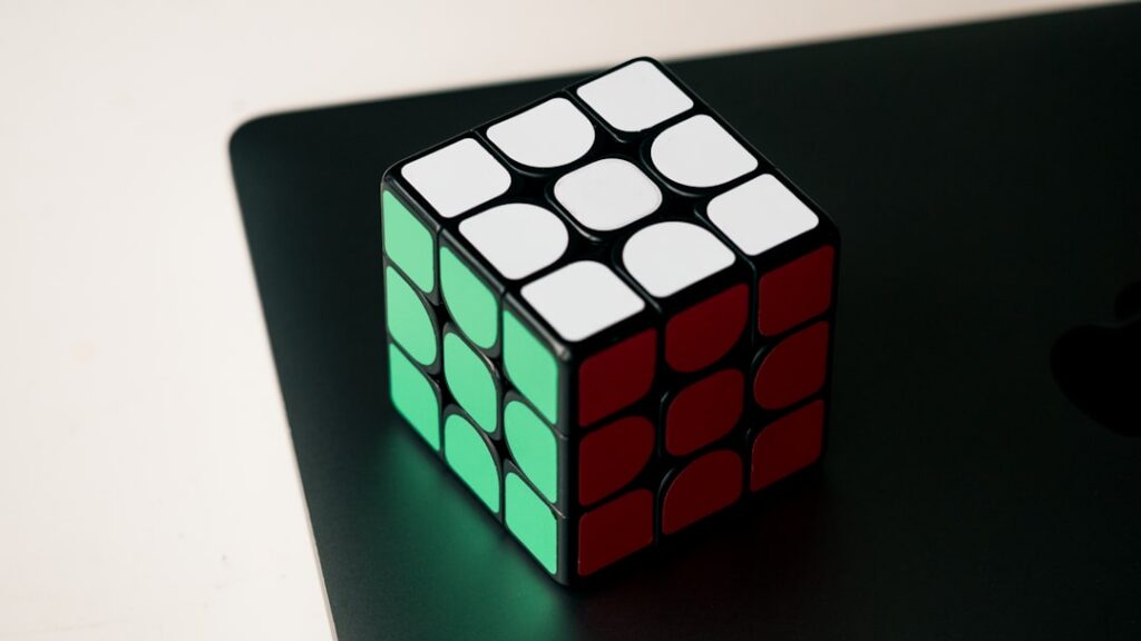 Single, brightly illuminated cube stands out in a grid of dark, uniform cubes, symbolizing a unique AI strategy that provi...