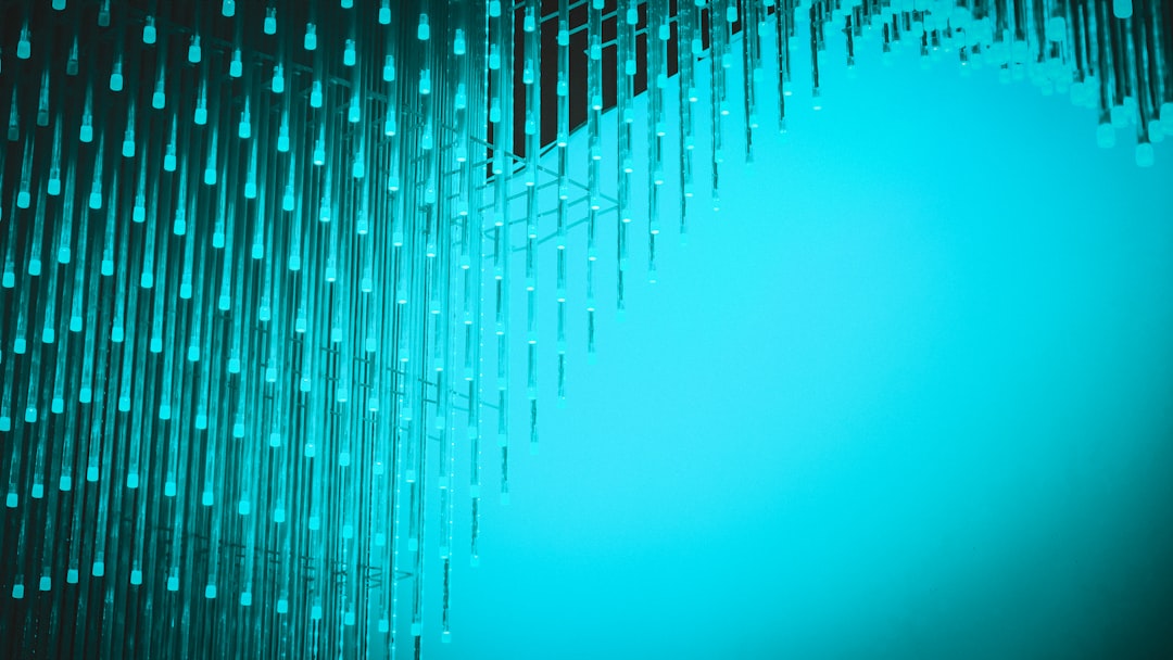 An abstract visualization of interconnected glowing blue nodes, representing the 'Brand as an API' concept and the machine-readable data structures required for AI marketing.