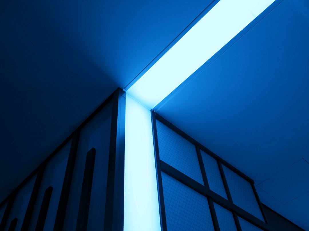 A detailed, glowing blue architectural blueprint on a dark background, representing the precise planning and structure required to architect a brand for AI.