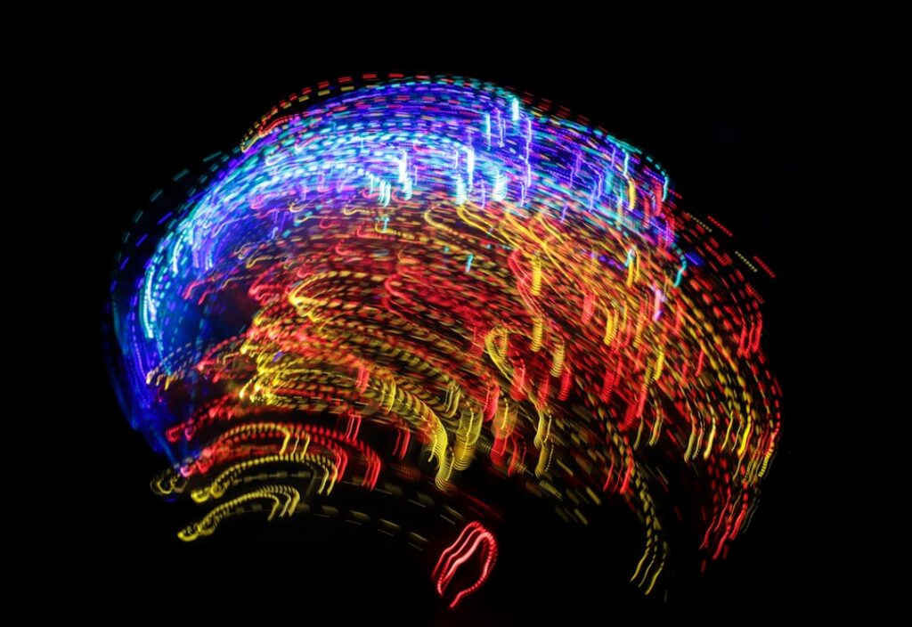 Abstract digital illustration of a glowing neural network forming the shape of a human brain, symbolizing AI consciousness...