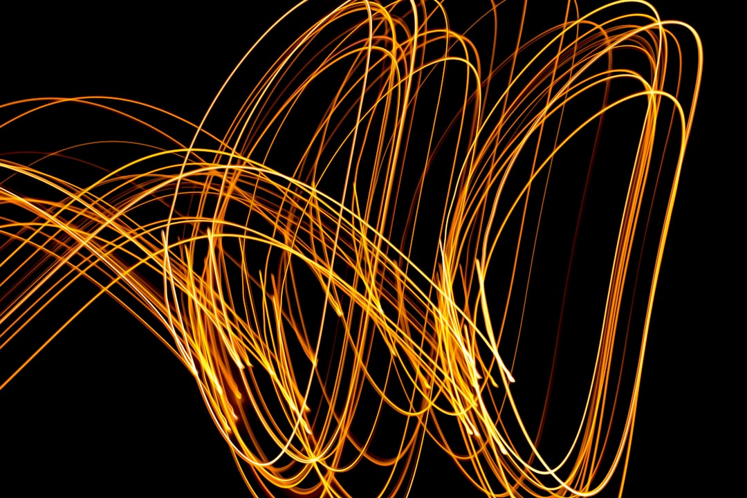Abstract image of colorful, flowing light trails on a dark background, illustrating the dynamic and adaptive nature of a computational brand.