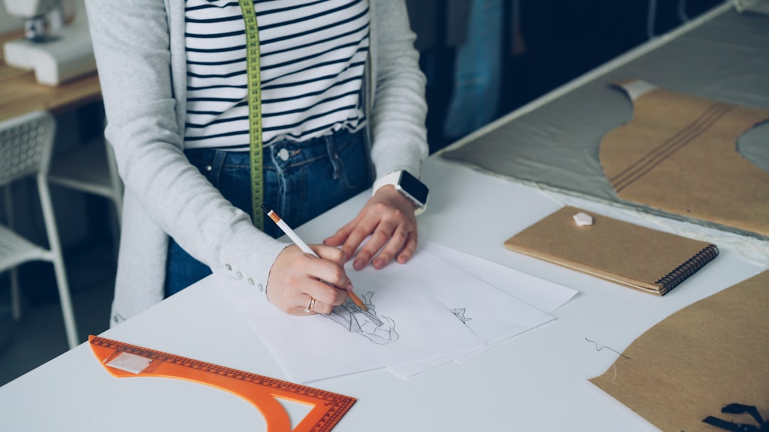 Close-up of an architect's hands carefully drawing a unique and complex blueprint, symbolizing the creation of custom intelligence and a competitive moat.