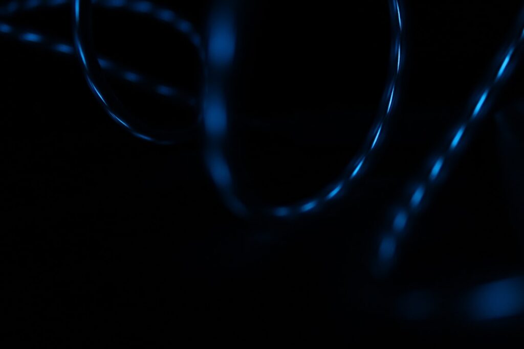 Abstract image of glowing, interconnected lines forming a complex network on a dark background, representing generative AI...