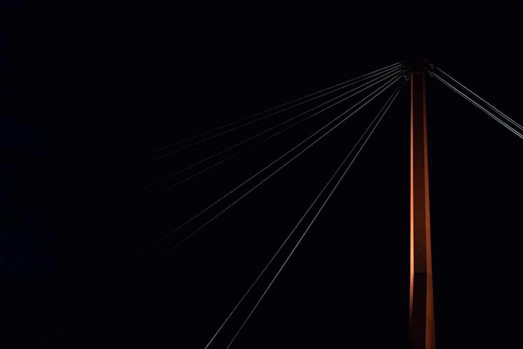 A crystal prism refracting a single beam of light into a colorful spectrum, symbolizing how multiple AIs interpret and present a brand's core identity.