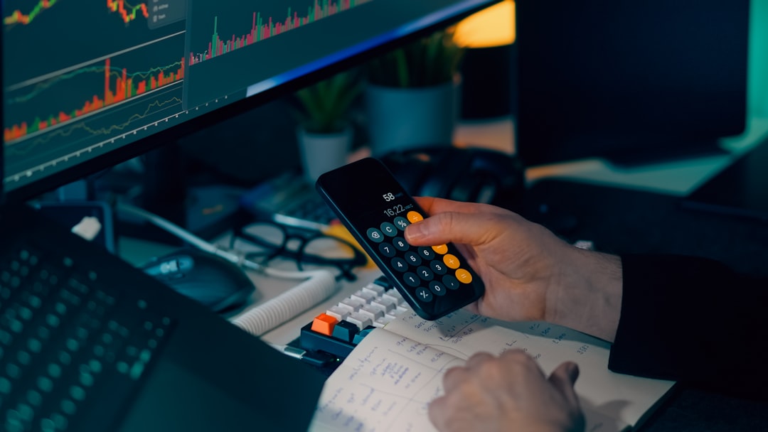 A close-up of a professional's hand interacting with a glowing, futuristic data interface, illustrating the codification of tacit knowledge into a digital asset.