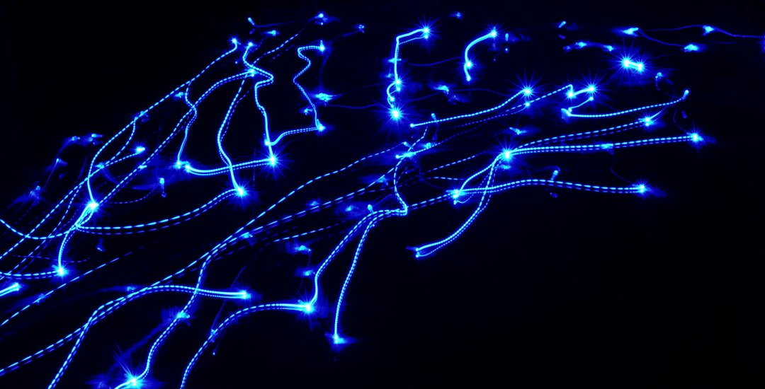 A modern, abstract image of glowing lines of light connecting nodes, symbolizing a futuristic data pipeline and network architecture.