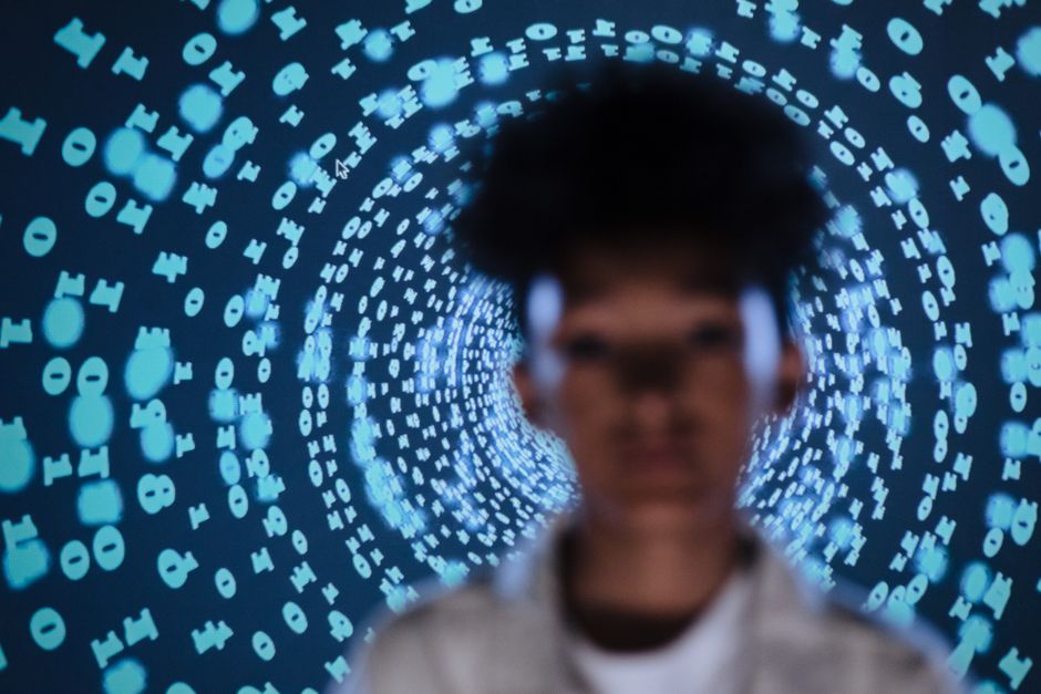 A professional in a modern setting architecting a complex data structure on a futuristic holographic interface, illustrating brand AI defense.