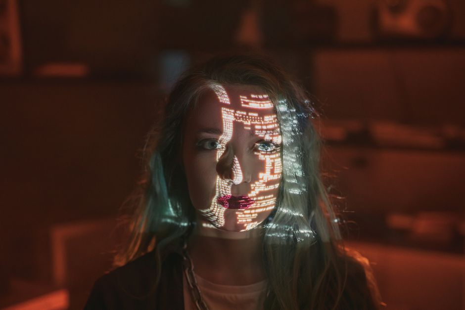 A minimalist digital rendering of a human head with a glowing neural network inside, representing an AI's synthetic perception and the concept of a synthetic sensorium.